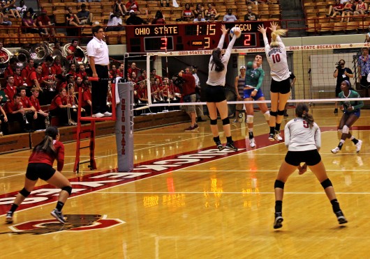 Sophomore middle blocker Taylor Sandbothe (10) and junior outside hitter Katie Mitchell (17) go for a block during a match against FGCU on Sept. 5 at St. John Arena. OSU won, 3-1. Credit: Emily Yarcusko