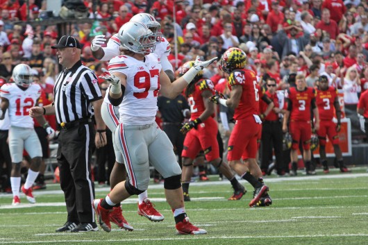 Former OSU and current San Diego Chargers defensive lineman Joey Bosa (97) celebrates after making a sack during a game against Maryland on Oct. 4, 2015 in College Park, Md. Credit: Lantern file photo