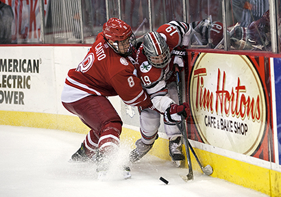 Senior forward Chad Niddery (19) is pinned to the boards during a game against Miami (Ohio) on Oct. 17 at the Schottenstein Center. OSU lost, 5-1, before falling again, 2-1, in Oxford, Ohio, on Oct. 18. Credit: Michael Griggs / For The Lantern