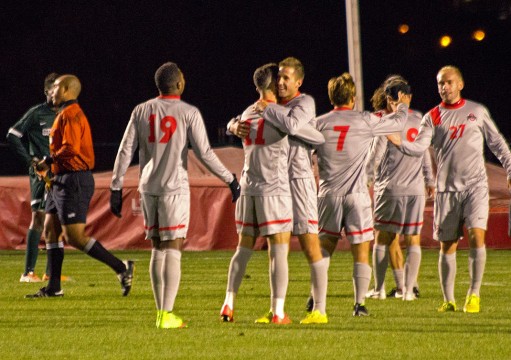 Members of the OSU men’s soccer team celebrate during its 3-2 win against Michigan State on Oct. 4 at Jesse Owens Memorial Stadium. Credit: Ed Momot / For The Lantern