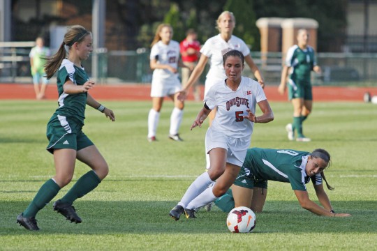 Then junior midfielder/forward Ellyn Gruber (5) pushes the ball up the field during a game against Eastern Michigan Aug. 25, 2013. OSU won 2-1 in OT. Credit: Lantern file photo