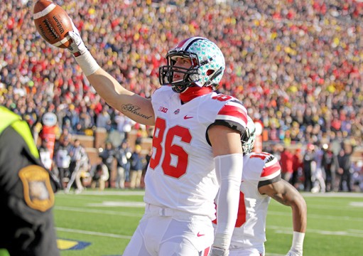 Then-junior tight end Jeff Heuerman (86) raises the ball into the air during a game against Michigan on Nov. 30 in Ann Arbor, Mich. OSU won, 42-41. Credit: Lantern file photo