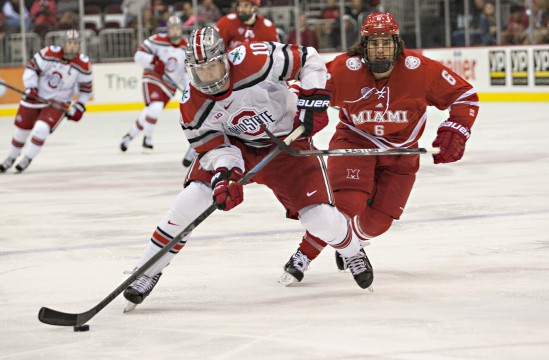 OSU senior forward Darik Angell advances the puck during a game against Miami (OH) Oct. 17. at the Schottenstein Center. OSU lost, 5-1. Credit: Michael Griggs / For The Lantern