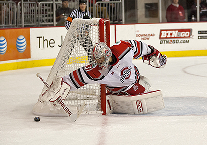 Sophomore goalie Matt Tomkins reaches for the puck during a game against Miami (Ohio) on Oct. 17 at the Schottenstein Center. OSU lost, 5-1. Credit: Michael Griggs / For The Lantern