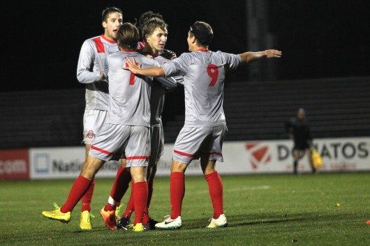 Members of the OSU men's soccer team celebrate during a 4-1 win against Rutgers on Oct. 25, 2014, at Jesse Owens Memorial Stadium. Credit: Lantern File Photo 