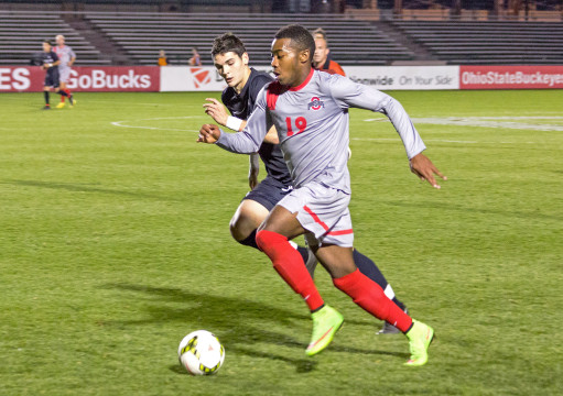 OSU freshman forward Marcus McCrary pushes the ball upfield in a game against Rutgers 