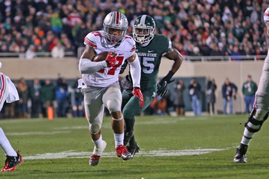 Redshirt-freshman H-back Jalin Marshall (17) carries the ball during a game against Michigan State on Nov. 8 in East Lansing, Mich. OSU won, 49-37. Credit: Mark Batke / Photo editor