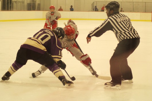 OSU then-junior forward Julia McKinnon faces off with a Western Ontario player Sept. 28 during an exhibition match at the OSU Ice Rink. OSU and Western Ontario tied 2-2. Credit: Lantern File Photo