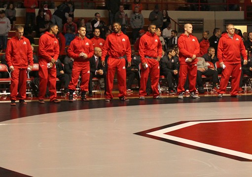 Members of the OSU wrestling team stand near the team bench during a match against Kent State on Nov. 13. OSU won, 38-3. Credit: Emily Yarcusko / For The Lantern