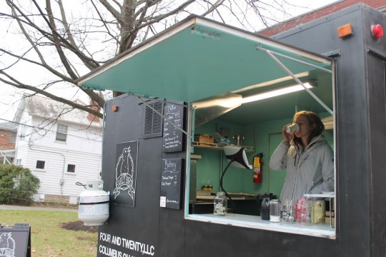 Erin Rinkel, employee of The Early Bird and fourth-year in early and middle childhood studies, drinks a beverage inside the food truck, which opens at 7 a.m. weekdays.  Credit: Alex Drummer / Oller reporter