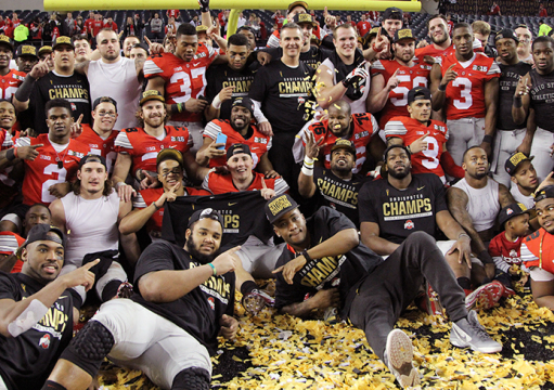 OSU players and coaches pose on the field at AT&T Stadium after the 2015 College Football Playoff National Championship against Oregon on Jan. 12 in Arlington, Texas. OSU won, 42-20. Credit: Mark Batke / Photo editor