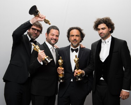 Nicolaas Giacobone, Alejandro G. Inarritu, Alexander Dinelaris, Jr. and Armando Bo pose backstage with the Oscar for Original screenplay, for work on ''Birdman or (The Unexpected Virtue of Ignorance)'' during the live ABC Telecast of The 87th Oscars at the Dolby Theatre in Hollywood. Credit: Courtesy of TNS.