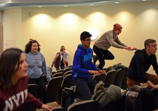  Members of Fishbowl Improv during a warmup exercise at their practice on Tuesday, February 18 in University Hall. Fishbowl Improv will be hosting The Tides improv festival this Friday and Saturday at the Ohio Union. Credit: Sallee Ann Ruibal / Lantern photographer