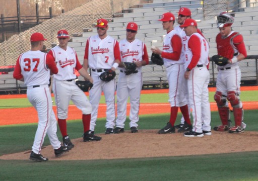 Members of the OSU baseball team gather on the pitcher's mound to meet during a game against Akron on March 25 at Bill Davis Stadium. OSU won, 9-4. Credit: Ethan Scheck / Lantern photographer