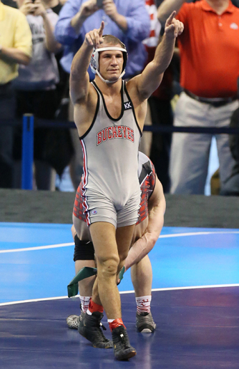 Redshirt-senior Logan Stieber reacts after winning his 4th consecutive NCAA title by beating Edinboro's Mitchell Port in the 141-pound championship match during the NCAA Division I Wrestling Championships on March 21 in St. Louis. Credit: Courtesy of TNS