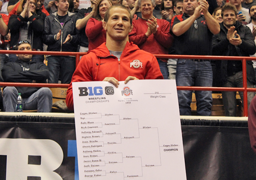Redshirt-senior Logan Stieber smiles as he is named 2015 Big Ten Champion on March 8 at St. John Arena. Stieber became the first-ever OSU wrestler to win the title 4 times.  Credit: Patrick Kalista / Lantern reporter