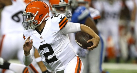 Cleveland Browns quarterback Johnny Manziel (2) evades the Detroit Lions' Kyle Van Noy during the second quarter in exhibtion action on Aug. 9, 2014, at Ford Field in Detroit.  Credit: Courtesy of TNS
