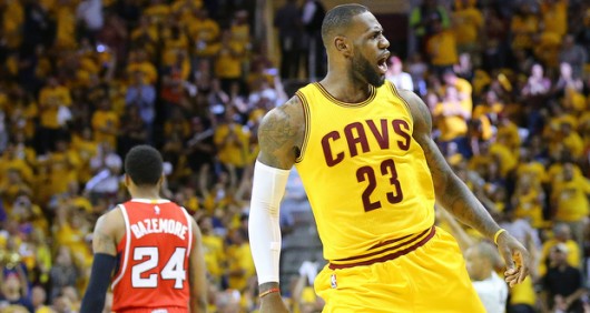 Cleveland Cavaliers' LeBron James reacts after stealing the ball from the Atlanta Hawks and driving the court for a slam as Hawks' Kent Bazemore walks away during Game 4 of the Eastern Conference Finals on May 26 at Quicken Loans Arena in Cleveland.  Credit: Courtesy of TNS