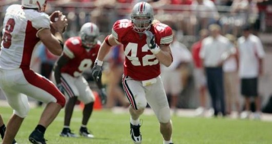 Former Ohio State linebacker Bobby Carpenter (42) rushes the quarterback. Credit: Courtesy of TNS