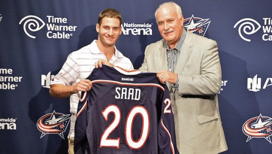 Columbus Blue Jackets forward Brandon Saad poses with team president John Davidson at his introductory press conference on July 15. Credit: Courtesy of bluejackets.com