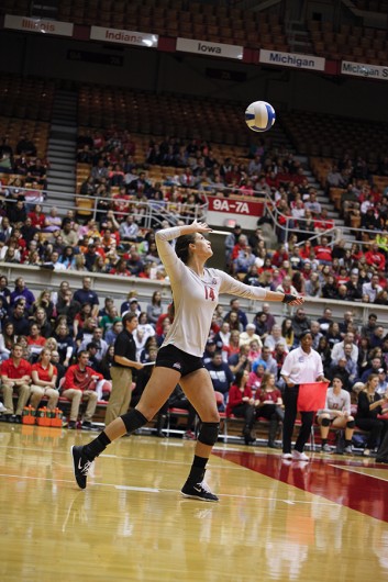 Then-junior Elizabeth Campbell (14) prepares to serve a ball during a game against Penn State on Oct. 31, 2014. Credit: Lantern File Photo 