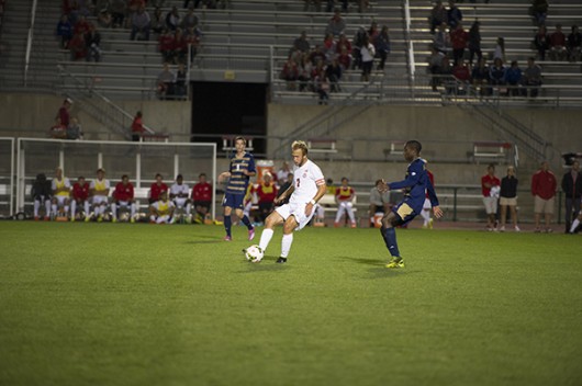 OSU junior midfielder Zach Mason (7) dribbles a ball during a game against Akron on Sept. 24 at Jesse Owens Memorial Stadium. OSU lost, 3-1. Credit: Lantern File Photo 
