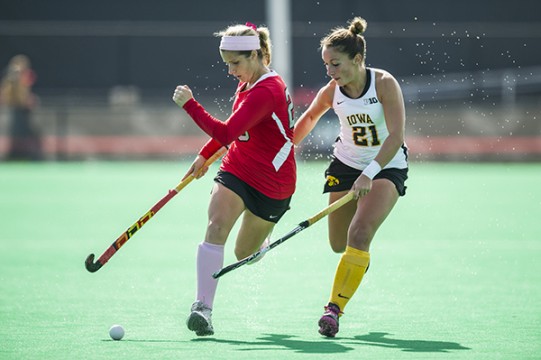 Then-freshman forward Maddy Humphrey (left) pushes the ball upfield during a game against Iowa Oct. 19, 2014 at Jesse Owens Memorial Stadium. OSU lost 4-2. Credit: Lantern File Photo