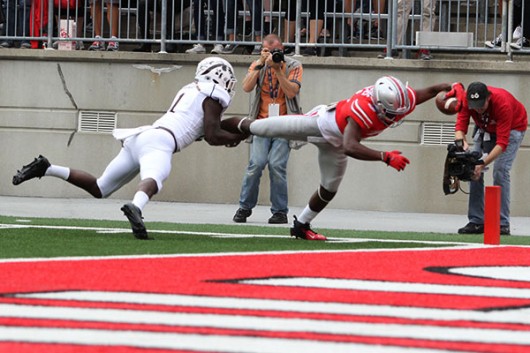 OSU redshirt junior wide receiver Michael Thomas (3) dives towards the end zone during the first quarter of a game against Western Michigan at Ohio Stadium on Sept. 26. OSU won, 38-12. Credit: Samantha Hollingshead / Photo Editor