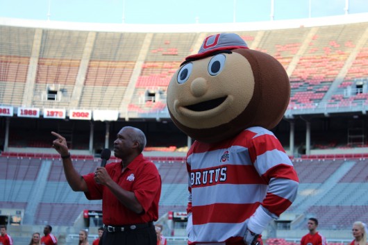 Brutus Buckeye and Ohio State Athletic Director Gene Smith participate during the “Buckeye Kick-Off” on August 27 at Ohio Stadium. Credit: Ed Momot / For The Lantern
