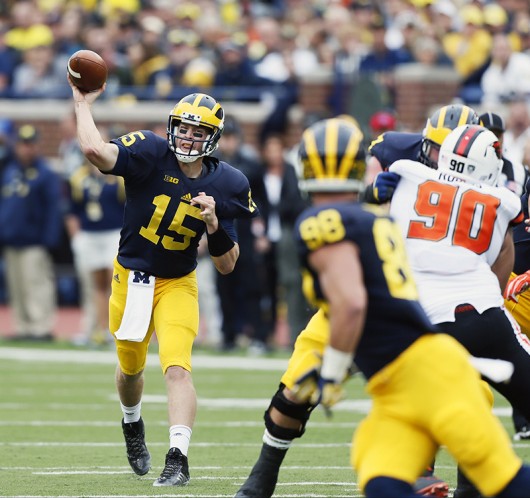 Michigan quarterback Jake Rudock (15) completes pass to tight end Jake Butt (88) in the second quarter against Oregon State at Michigan Stadium in Ann Arbor, Michigan, on Sept. 12. Michigan won, 35-7. Credit: Courtesy of TNS