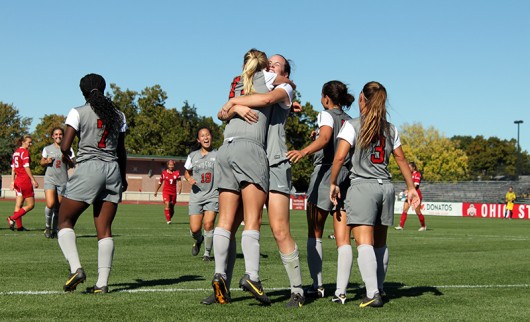OSU women’s soccer players celebrate during a game against Indiana on Sept. 26, 2014. Credit: Lantern File Photo