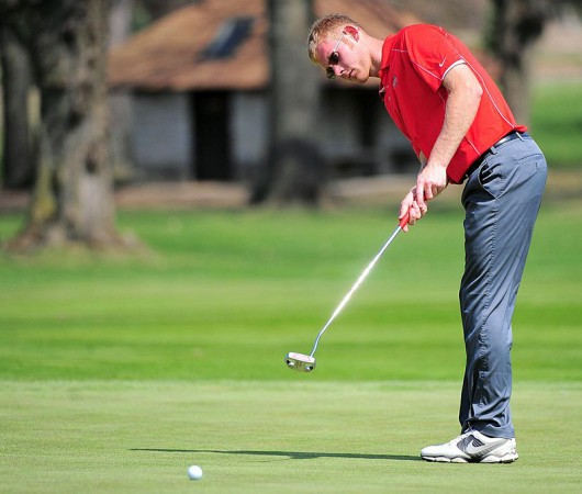 Redshirt-junior Michael Bernard roles a putt towards the hole during one of OSU's matches in 2014. Courtesy of OSU athletics  