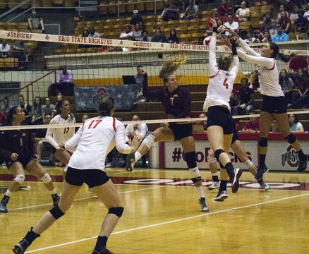 Members of the OSU women's volleyball team during a game against Minnesota on Sept. 23 at St. John's Arena. Credit: Massarah Mikati / Lantern Photographer 
