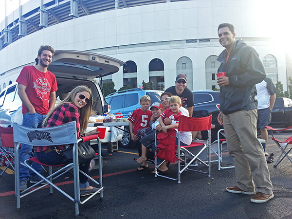 Tami Smith, an alumna, and her family tailgating at Ohio Stadium during the game against Northern Illinois University on Saturday, Sept. 18. Credit: Michael Huson / Campus Editor
