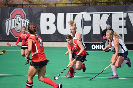 OSU redshirt sophomore midfield/back Carolina Vergroessen (28) runs with the ball while being trailed by California players during a field hockey game on Oct. 25, 2015, at Buckeye Varsity Field. OSU won 6-3. Credit: Robert Scarpinito | Managing Editor for Design 
