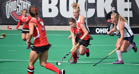 OSU redshirt sophomore midfield/back Carolina Vergroessen (28) runs with the ball while being trailed by California players during a field hockey game on Oct. 25, 2015, at Buckeye Varsity Field. OSU won 6-3.