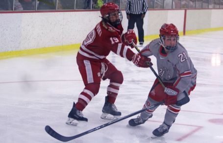 OSU then-sophomore defenseman Alexa Ranahan (21) skates away from a Wisconsin player during a game at the OSU Ice Rink on Feb. 13. OSU lost, 2-0. Credit: Lantern File Photo