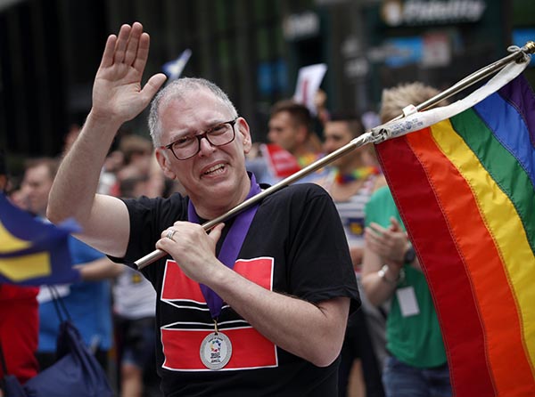 Jim Obergefell, the named plaintiff in the historic marriage equality case decided by the U.S. Supreme Court last week, rides as a guest of honor in the San Francisco Pride Celebration and Parade on Sunday, June 28, 2015. Credit: Courtesy of TNS 