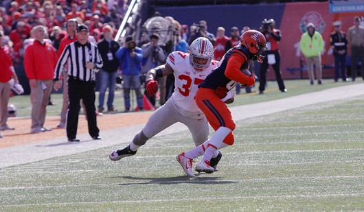 OSU senior linebacker Joshua Perry (37) attempts to tackle Illinois wide receiver Desmond Cain (86) during a game on Nov. 14 at Memorial Stadium in Champaign, Illinois. OSU won 28-3. Credit: Samantha Hollingshead | Photo Editor