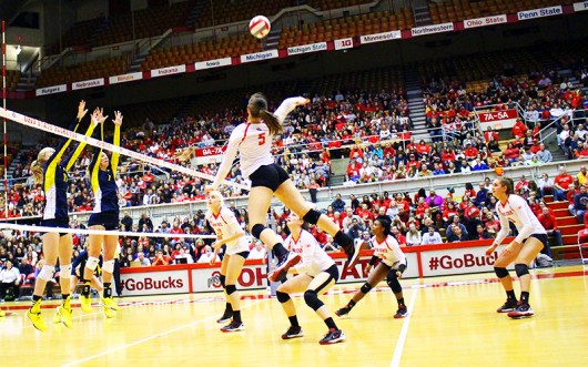 Members of the OSU women's volleyball team during a game against Michigan on Nov. 14 at St. John Arena. OSU lost 3-0. Credit: Giustino Bovenzi | Lantern Photographer