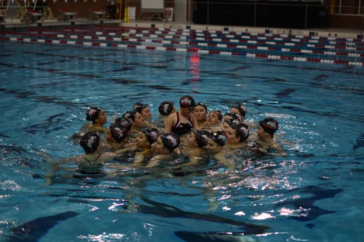 Members of the OSU synchronized swimming team gather around their newest teammate on Nov. 19. Credit: Kevin Stankiewicz | Assistant Sports Editor 