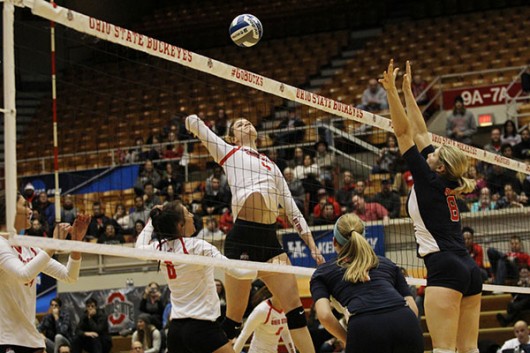 OSU senior middle blocker Andrea Kacsits (4) during a game against Robert Morris in the NCAA tournament on Dec. 4 at St. John Arena. OSU won/lost. Credit: Samantha Hollingshead | Photo Editor