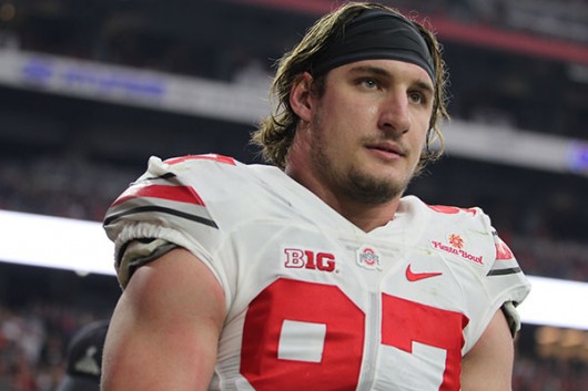 OSU junior defensive end Joey Bosa walks off the field after being ejected in the first quarter of the Fiesta Bowl on Jan. 1. OSU won, 44-28. Credit: Samantha Hollingshead | Photo Editor 
