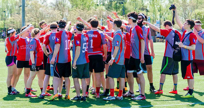 Members of the Ohio State Quidditch League huddle during a match. Credit: Courtesy of Jessica Jiamin Lang Photography