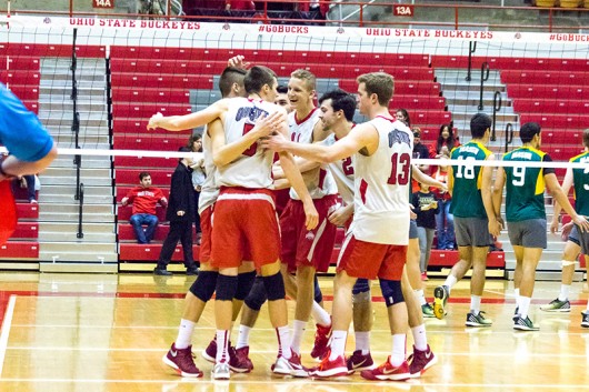 Members of the OSU men’s volleyball team celebrate during a game against George Mason at St John Arena on Jan. 15. Credit: Ed Momot | For The Lantern