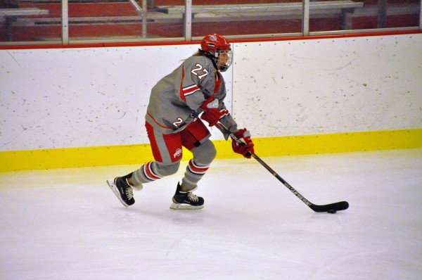 OSU sophomore forward Lauren Spring (27) controls the puck during a game against Minnesota on Oct. 16 at the OSU Ice Rink. OSU lost 7-2. Credit: Courtesy of OSU