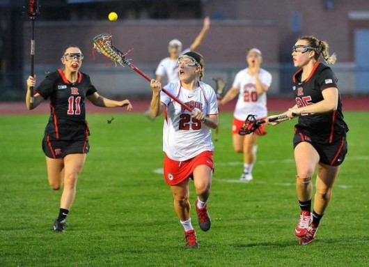 Then-junior midfielder Christine Easton (25) catches the ball during a game against Rutgers on April 16. OSU won 17-7. Credit: Courtesy of OSU