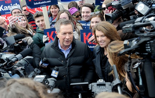 Governor of Ohio and 2016 Republican presidential candidate John Kasich greets voters while arriving at a polling station in Concord, New Hampshire on Feb. 9. Credit: Courtesy of TNS