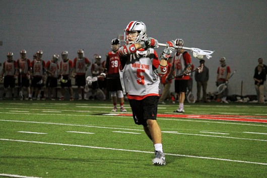 OSU freshman attacker Jack Jasinski (5) runs with the ball during a scrimmage against The Hill Academy on Jan. 30. Credit: Kylie Bryant | | For The Lantern