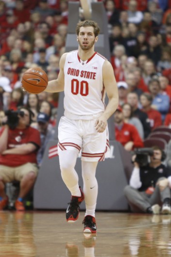 OSU freshman forward Mickey Mitchell (00) takes the ball up the court during a game against Maryland on Jan. 31 at the Schottenstein Center. Credit: Courtesy of OSU
